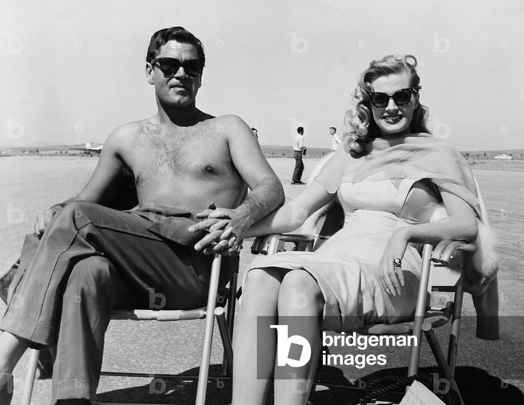 BACK FROM ETERNITY, from left: Anthony Steel, Anita Ekberg on set, 1956