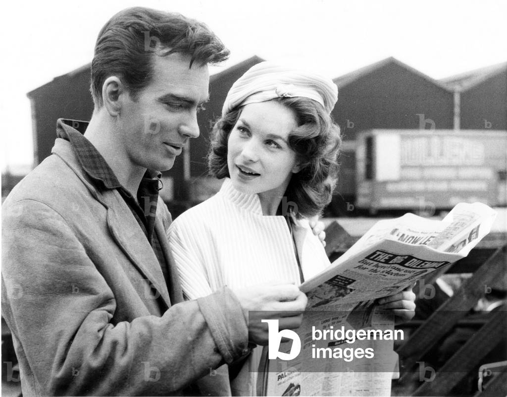THE GOOD COMPANIONS, from left, John Fraser, Shirley Anne Field, on location  at the Watford railway station, 1957