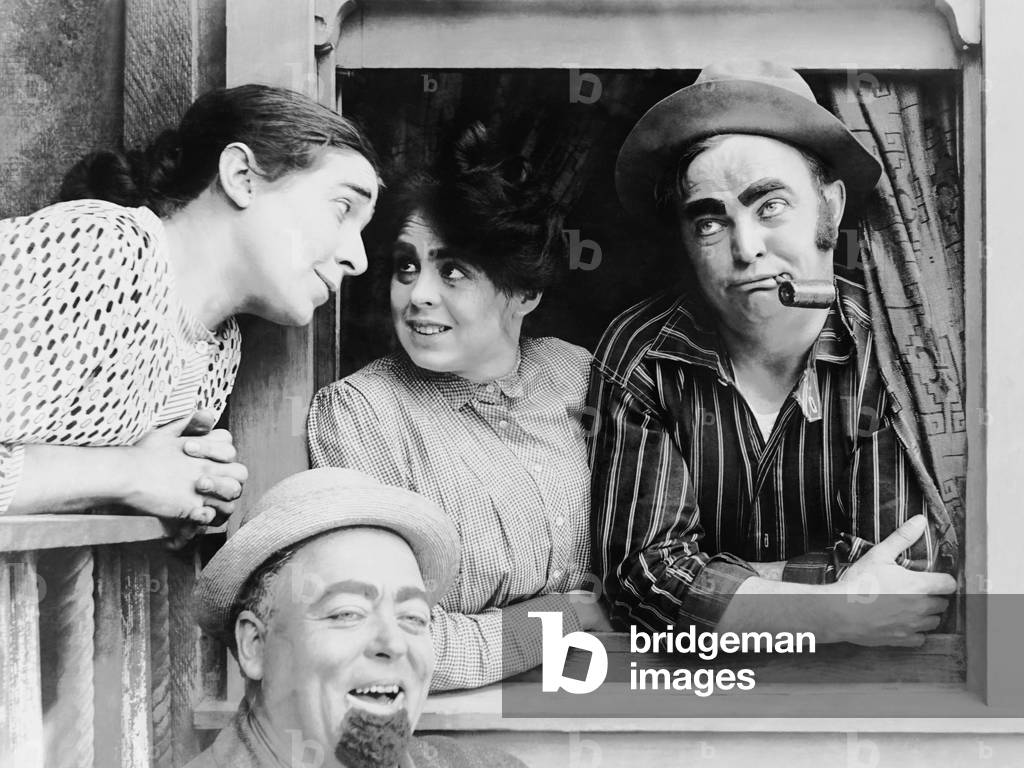 A DOLLAR DID IT, from left: Laura Oakley, Nick Cogley (bottom), Dot Farley, Fred Mace, 1913