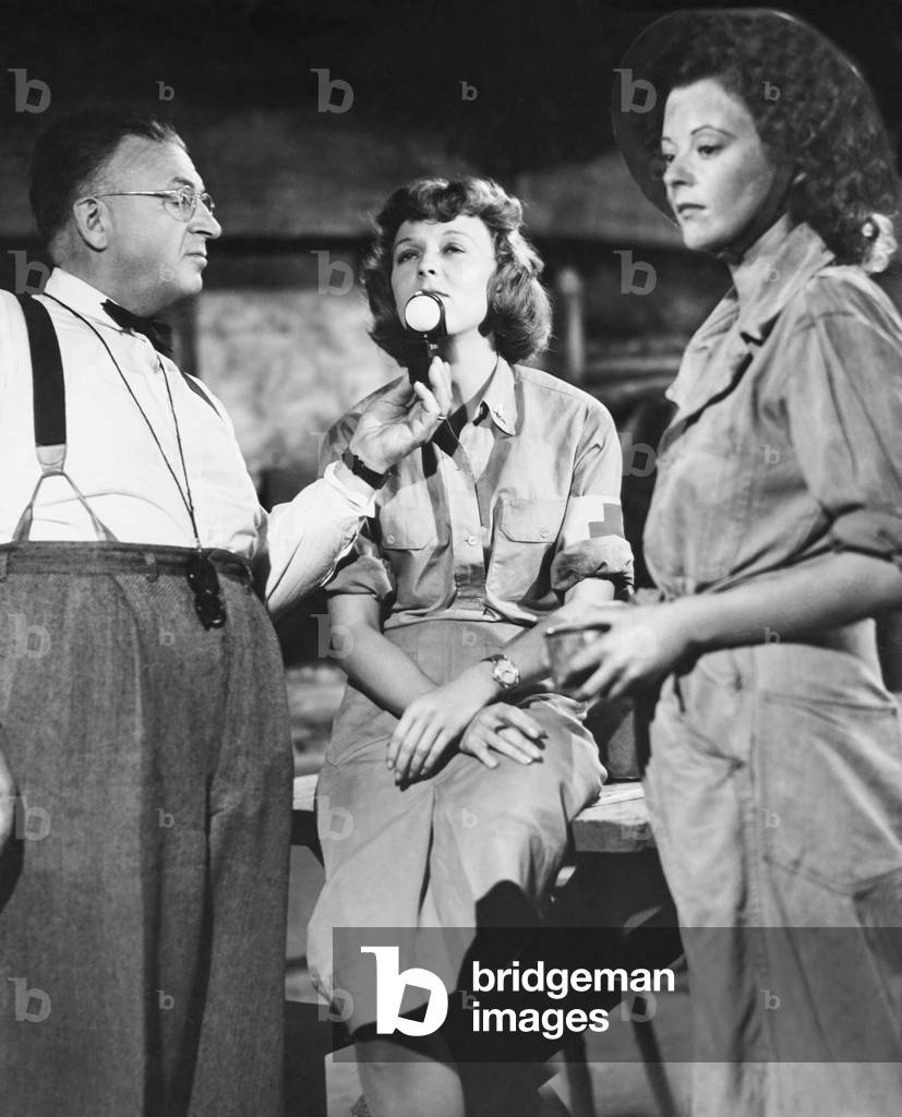 CRY HAVOC, from left: cinematographer Karl Freund, Margaret Sullavan, Heather Angel on set, 1943