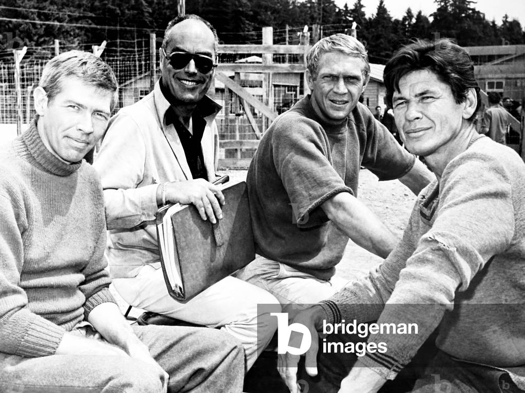 THE GREAT ESCAPE, from left James Coburn, director John Sturges, Steve McQueen, Charles Bronson, on location in Germany, 1963