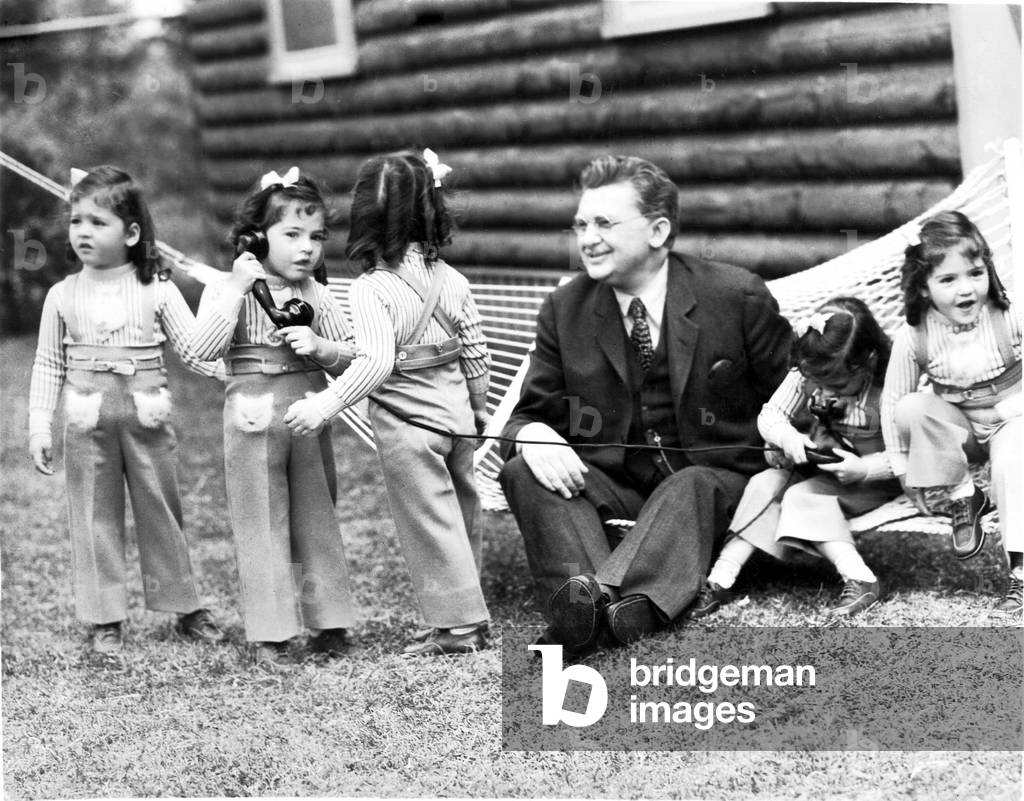FIVE OF A KIND, Jean Hersholt with the Dionne quintuplets (Cecile, Yvonne, Annette, Emilie, Marie), 1938, 20th Century Fox