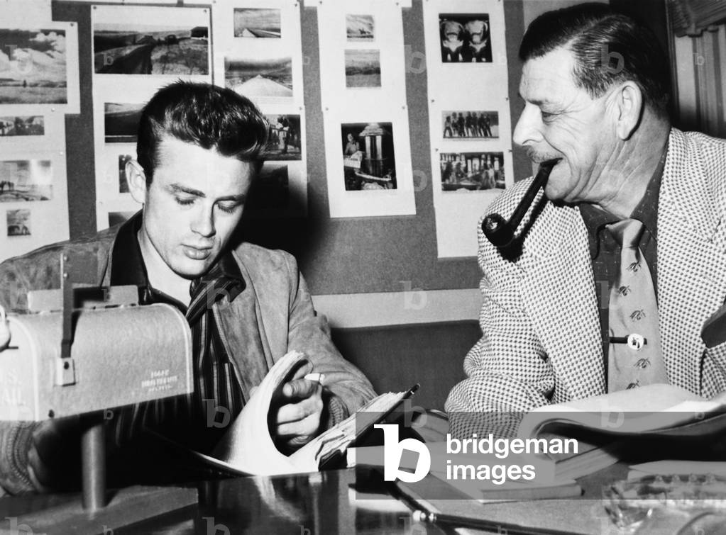 GIANT, from left: James Dean, screenwriter Fred Guiol, 1956