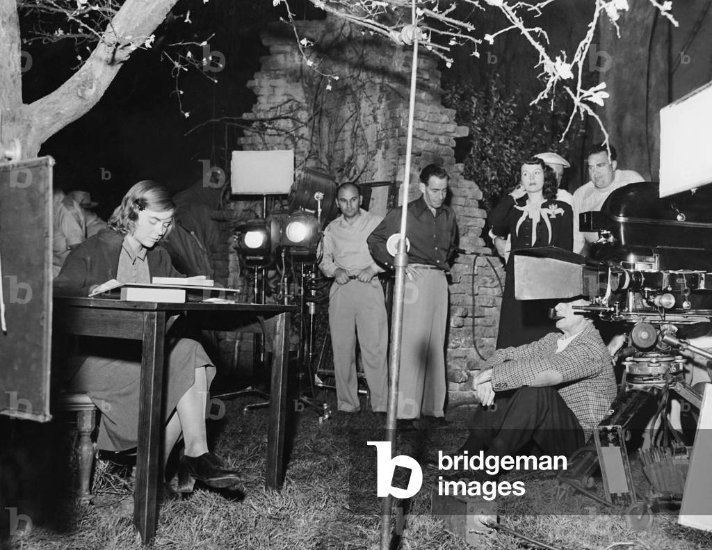THE ENCHANTED COTTAGE, seated from left: Dorothy McGuite, director John Cromwell on set, 1945