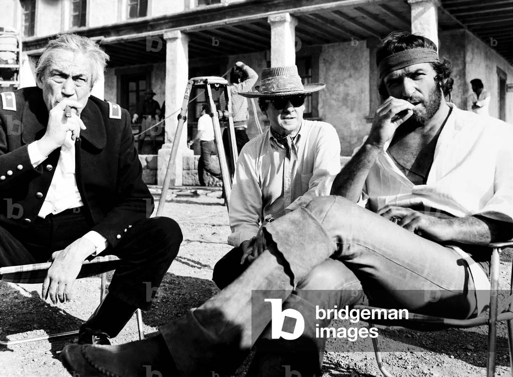THE DESERTER, (aka THE DEVIL'S BACKBONE), from left, John Huston, director Burt Kennedy, Bekim Fehmiu, on-set, 1971