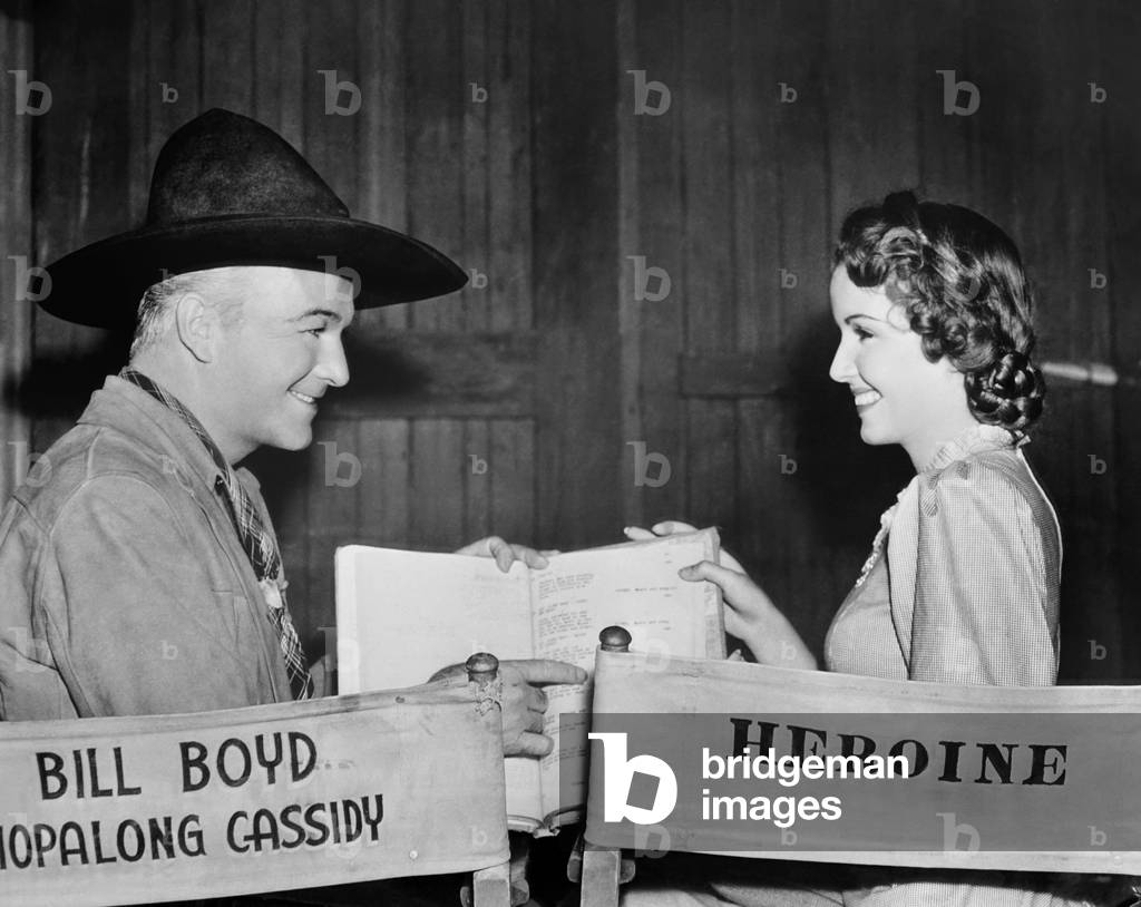 BORDER VIGILANTES, from left: William Boyd, Frances Gifford on set, 1941