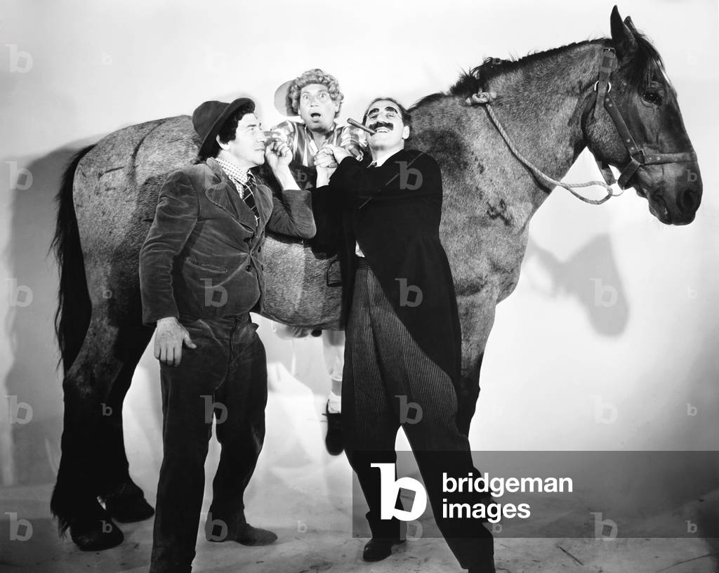 A DAY AT THE RACES, from left: Chico Marx, Harpo Marx, Groucho Marx, 1937