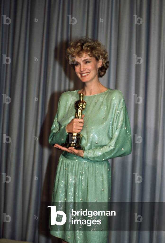 1982: Best Supporting Actress JESSICA LANGE [Tootsie] happily holds her statuette, 1983