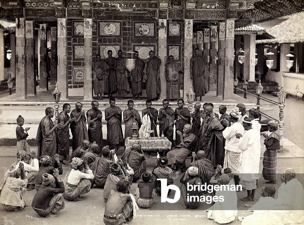Group of Indian Buddhists meeting to pray around an altar, in front of a temple in Ceylon (Sri Lanka),  1879 (print on double-weight paper)