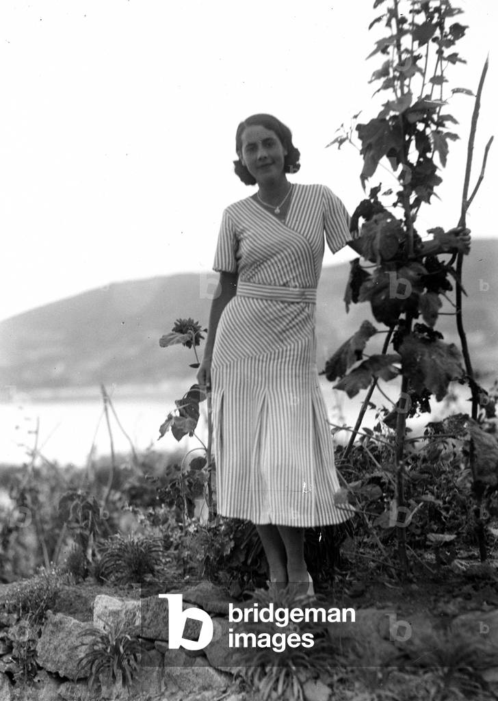 Female portrait. In the background the sea of ​​Elba Island
