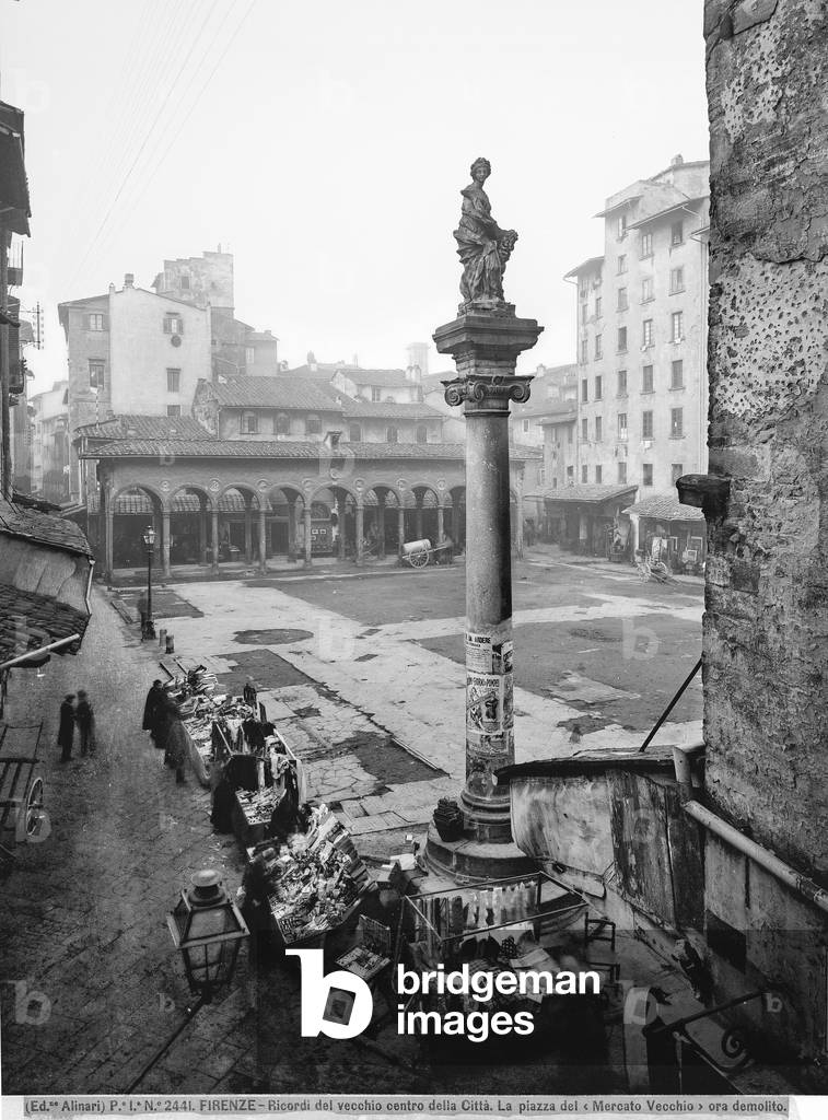 The piazza del Mercato Vecchio (today's piazza della Repubblica) in the ghetto of Florence. In the foreground the column with the statue of Abbandanza is visible and in the background the Loggia del Pesce, now placed in Piazza dei Ciompi in Florence