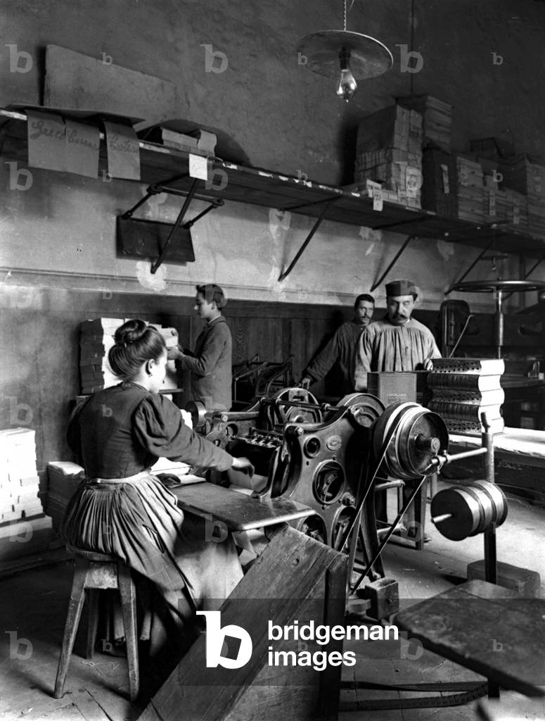Artisans at work in the binding department of the 