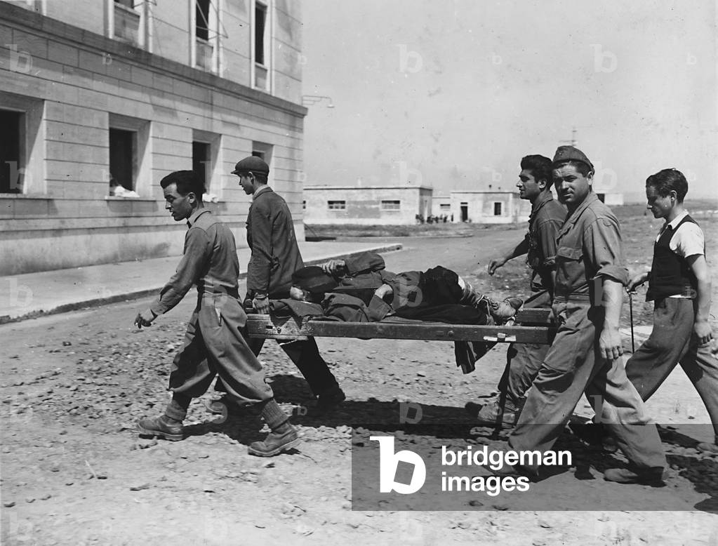 Carrying a sick refugee to hospital of Cesano (b/w photo)
