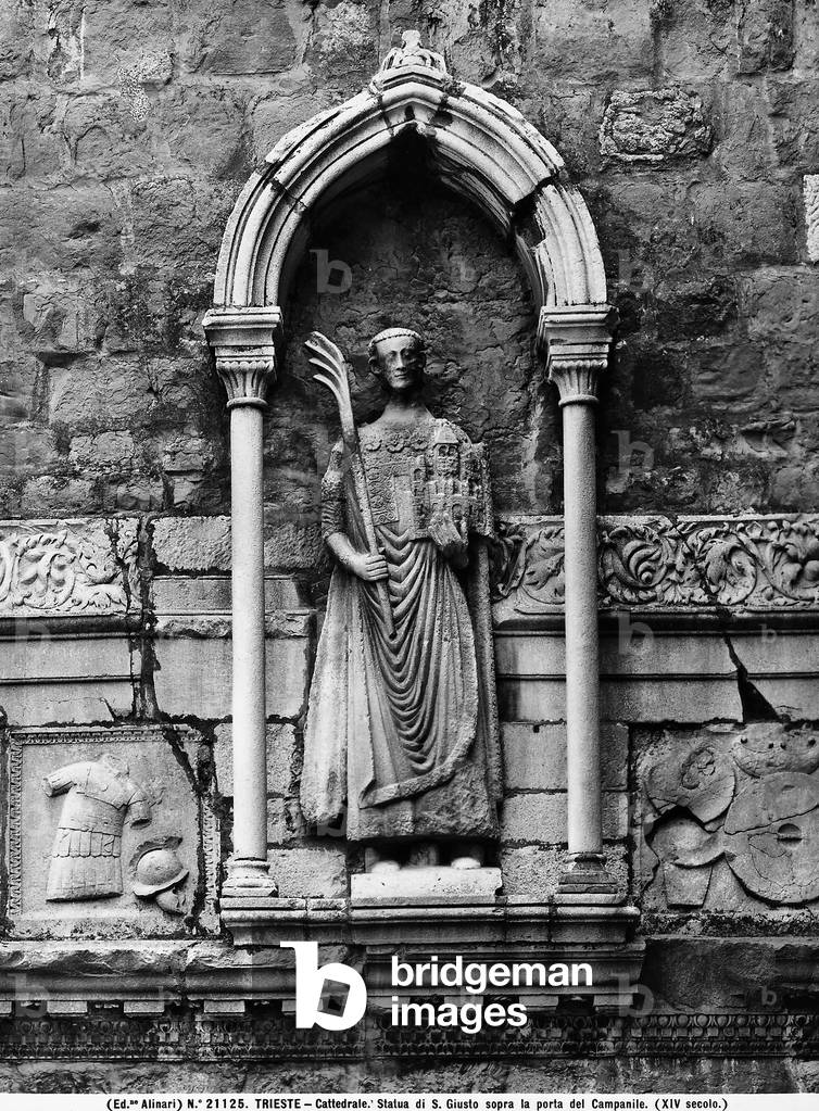 Niche containing a Romanesque-Byzantine statue of Saint Justus, whose head dates back to the Roman period, on the side of the bell tower of the cathedral of San Giusto, Trieste