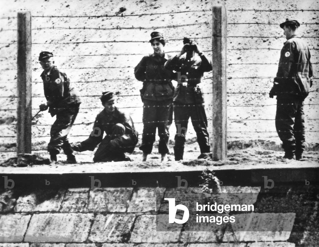 Military guards at the Berlin Wall, Humboldthafen.
