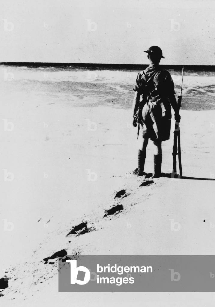 A private 'Tommy' on the sand beach in Egypt, 24/10/1939 (b/w photo)