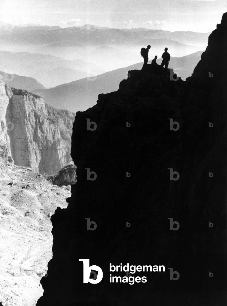 Mountain climbers on a rocky peak