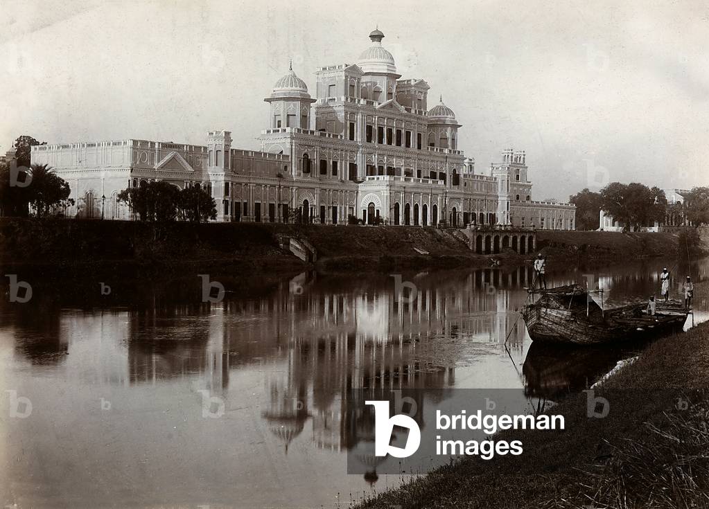 The building of the Chhatar Manzil reflected on the waters of a river, Lucknow, India