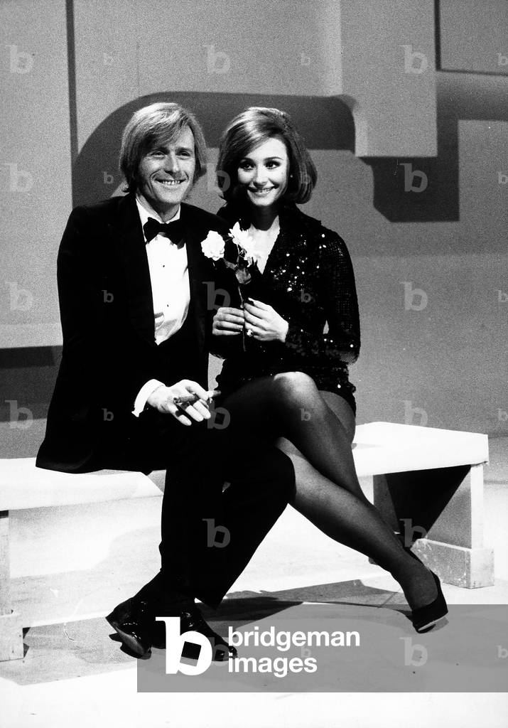 Raffaella Carrà and Nino Ferrer photographed during a television broadcast.