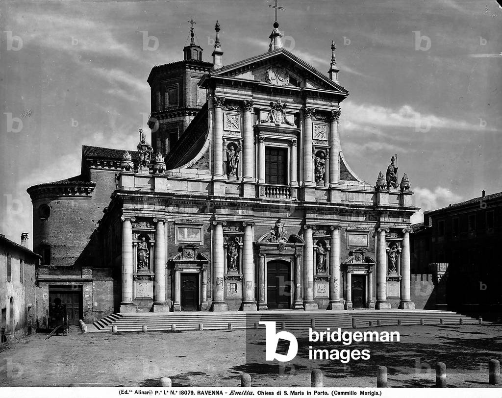 Façade of the Church of Santa Maria in Porto, near Ravenna, on two levels in Palladian style. The entrance is accessible through steps.