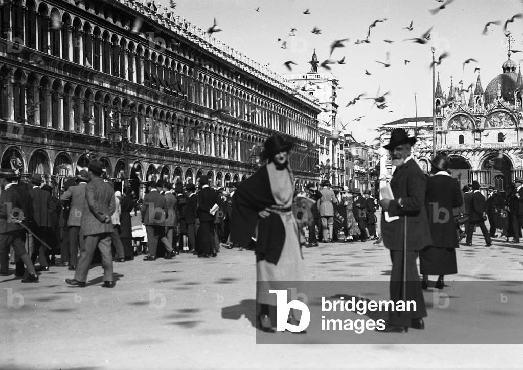 A young woman and a man in Piazza San Marco, Venice