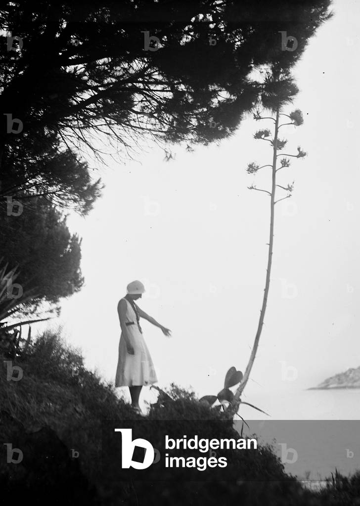 Woman photographed on a promontory of the island