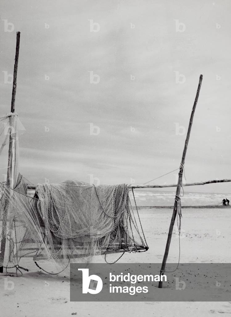 Fishing nets spread out on the beach