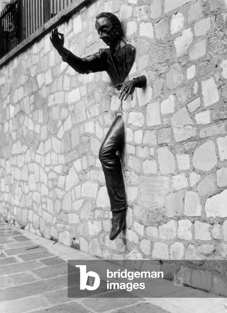 The writer Marcel Ayme represented by Jean Marais as the Pass-Muraille of his story in Paris (b/w photo)