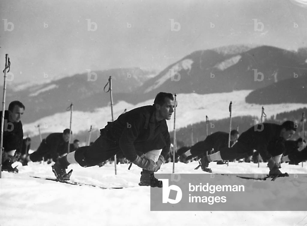 Cadet officers of the Fascist Academy of the Foro Mussolini on the snow fields. (b/w photo)