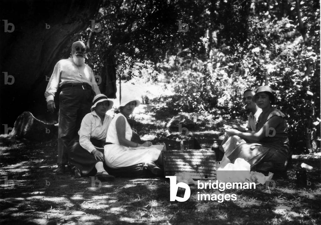Group of people having a picnic in a glade in the Matopo Mountains in Rhodesia, the present Zimbabwe
