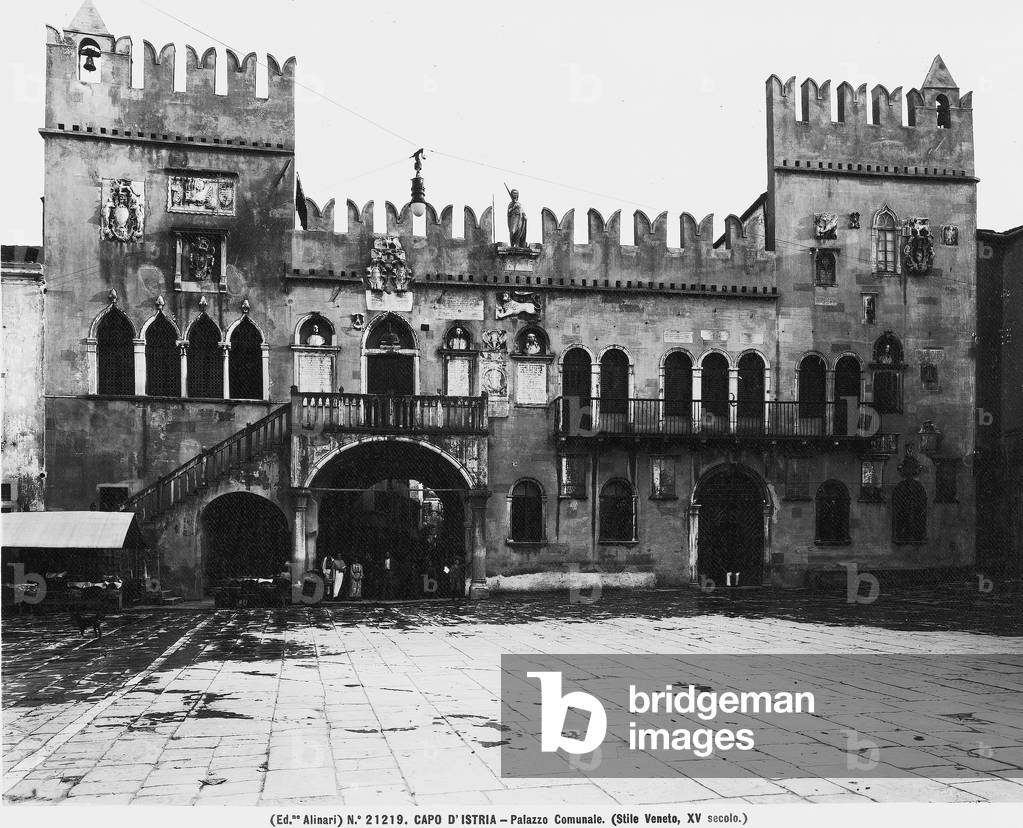 View of City Hall in Koper. Embattled building with two towers on the side in Venetian style.