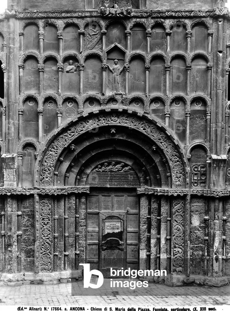 Detail of the facade of the Church of S. Maria della Piazza, Ancona. The splay portal is framed with a richly sculpted frieze and is surmounted by three rows of blind galleries.