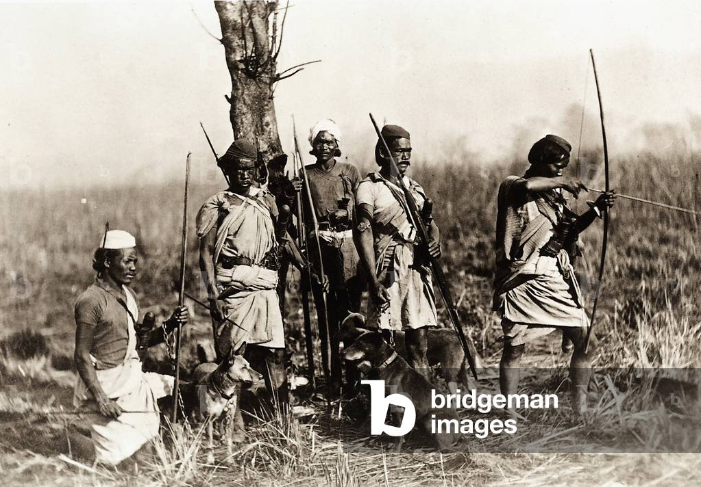 Group of Indian hunters armed with bows, knives and dogs for the tiger hunt, 1864 (print on double-weight paper)