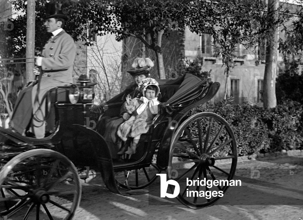 Portrait of a lady with baby on board a coach to Catania