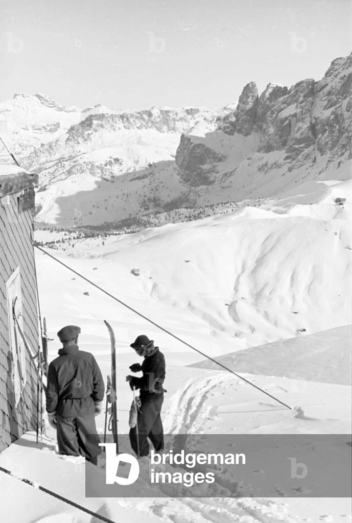 Snowy mountain landscape with skiers, Cortina d'Ampezzo