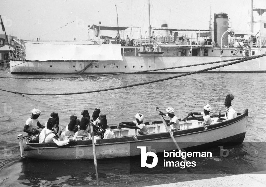 Group of Eritrean sailors in a boat in Massaua, in Eritrea, 1920-1940 (print on double-weight paper)