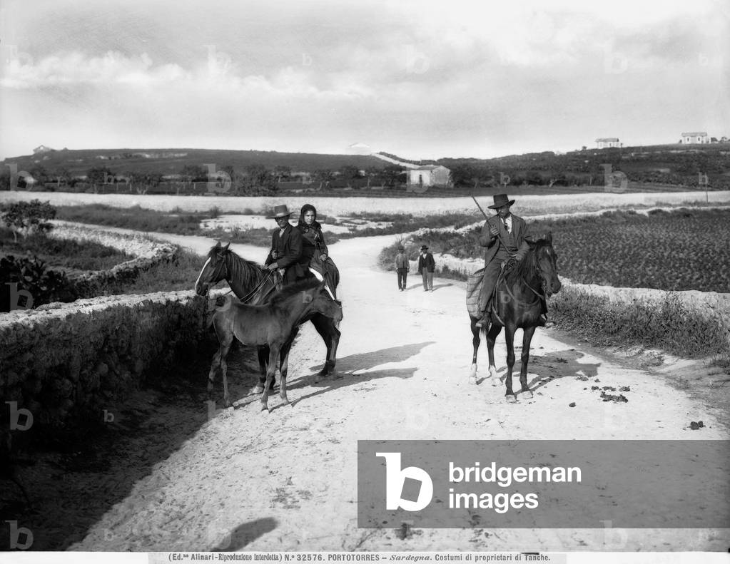 View of a county road, with people on horseback in the city of Porto Torres, Sardinia.