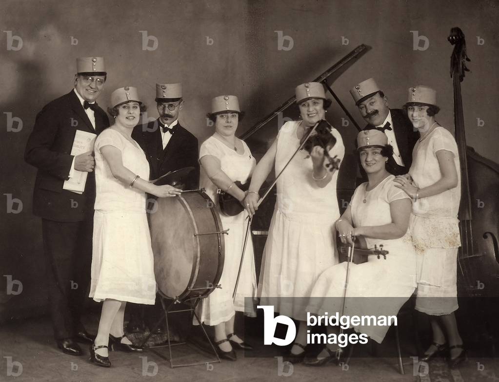 Group portrait of people with musical instruments