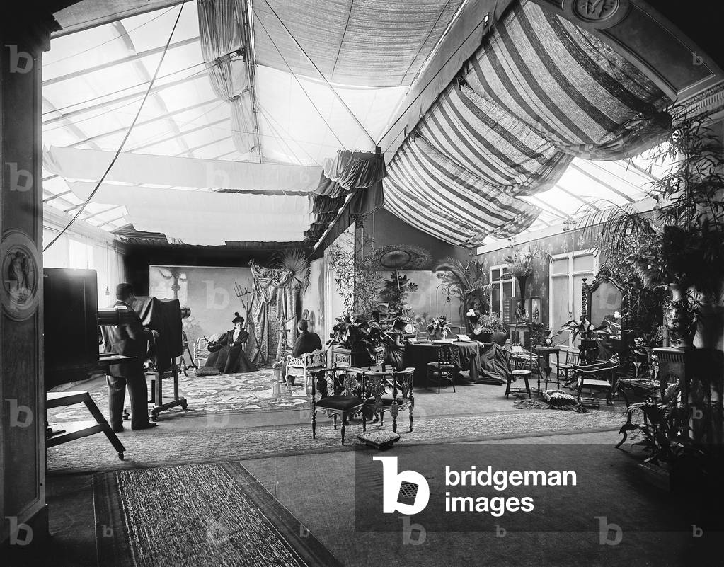 The luminous portrait studio of the Alinari Brothers' photographic establishment, in Florence. On the left the photograph Gaetano Puccini