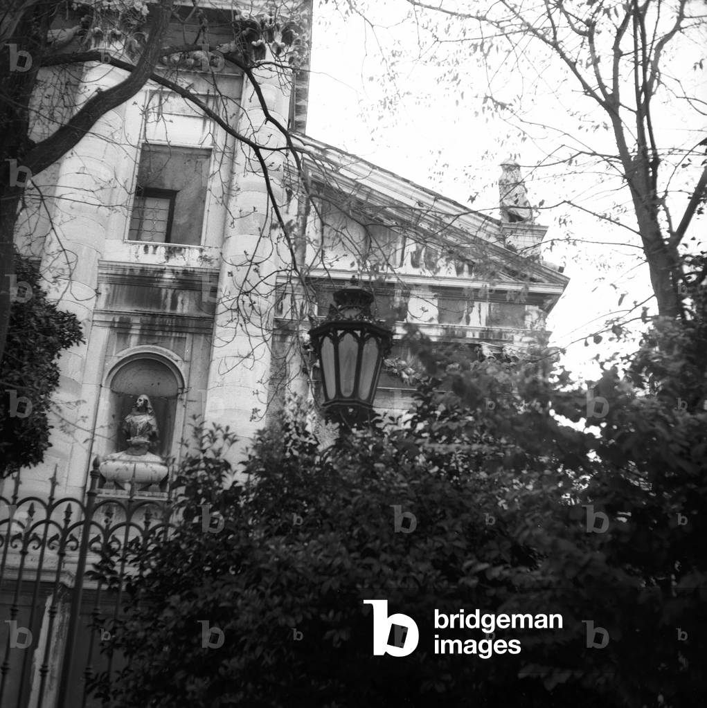 Facade of a church photographed in a garden in Venice (b/w photo)