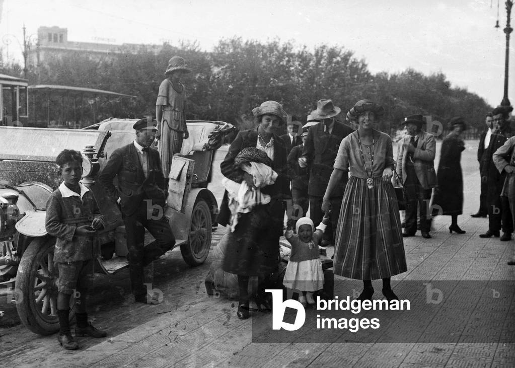 Group portrait next to a car