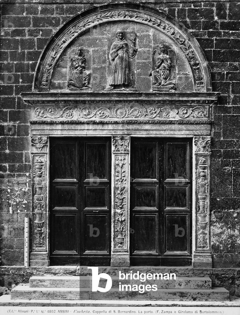 Door of the Oratory of San Bernardino da Siena, Assisi. St. Bernard is shown between two angels inside a lunette.