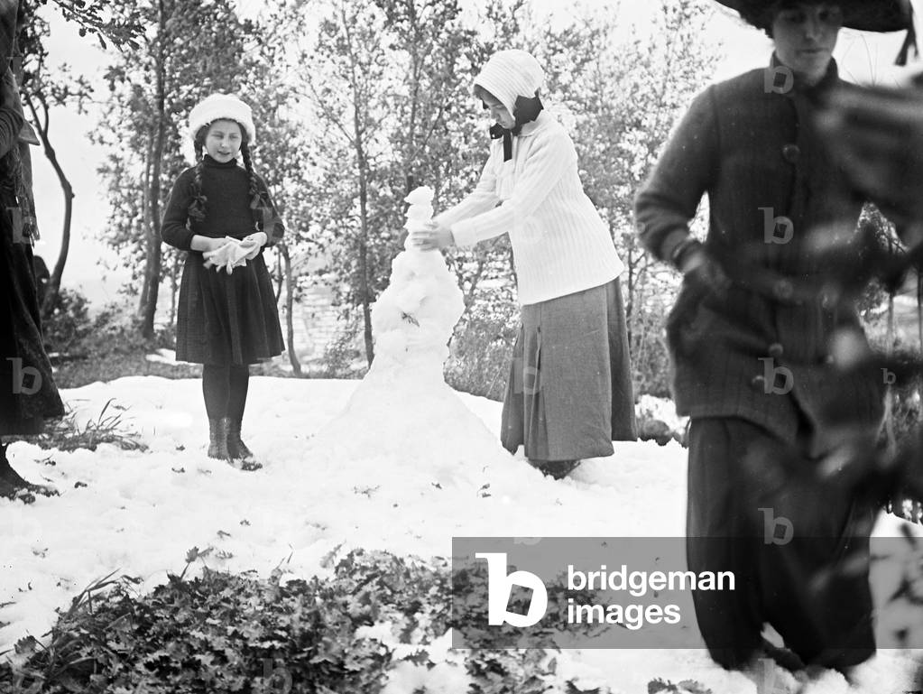 Group photographed while achieving a snowman