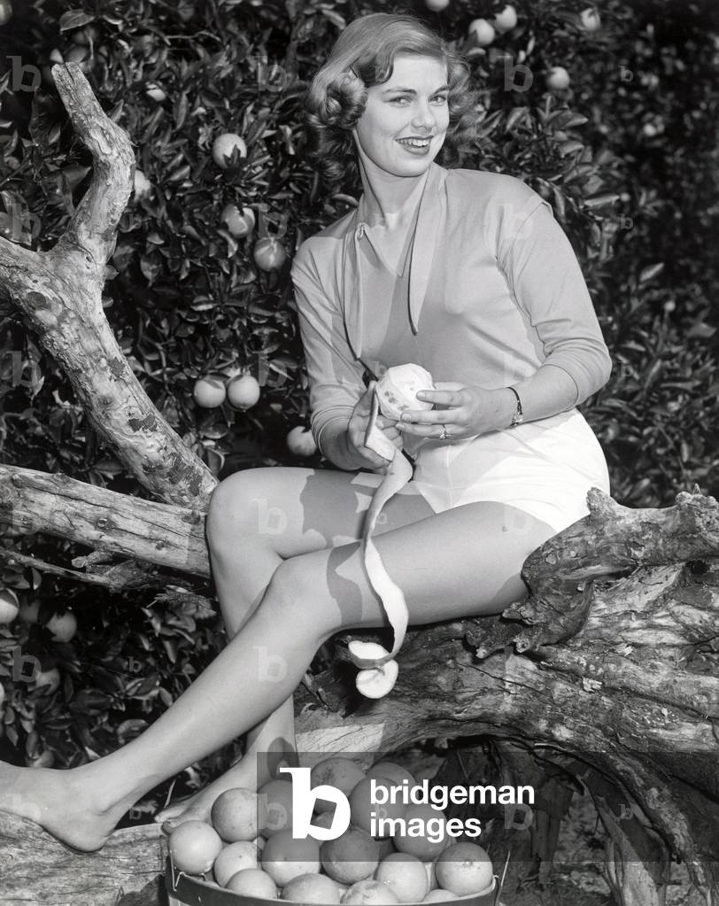 girl peels an orange, 1955