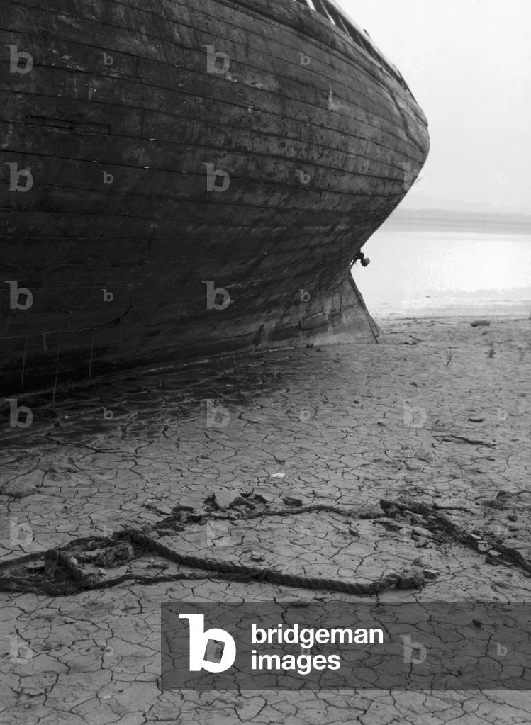 Hull of a boat on the beach, Pas de Calais, 1963 (b/w photo)