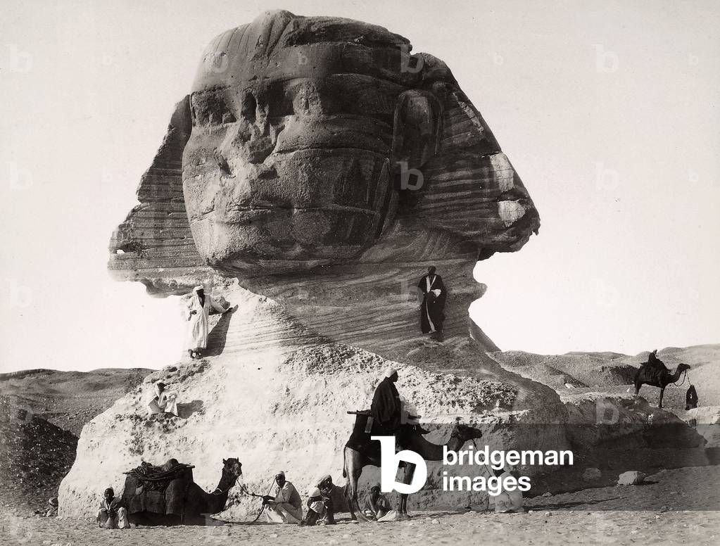 Men and camels around the Sphinx of Chefren, in Giza, Egypt