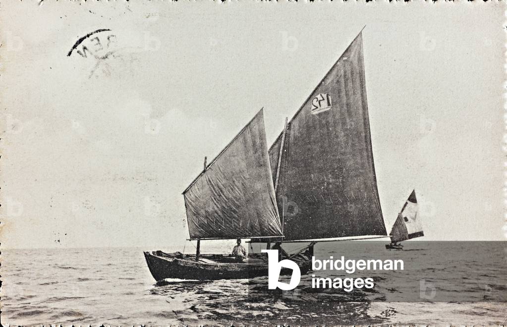 Men aboard sailboats; postcard