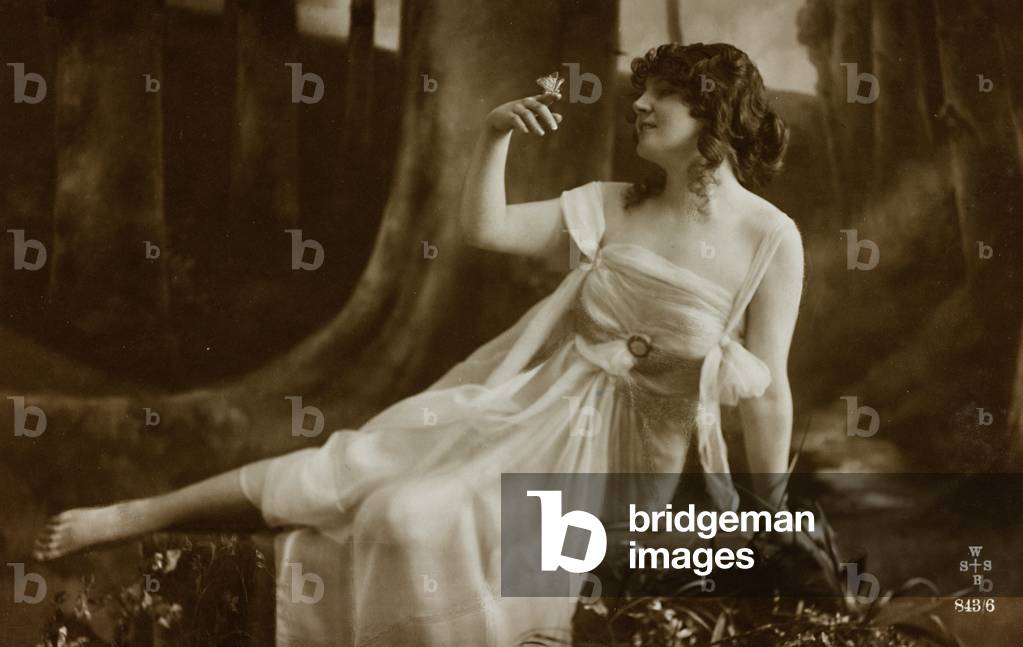 Postcard depicting a woman in a forest with a butterfly, 