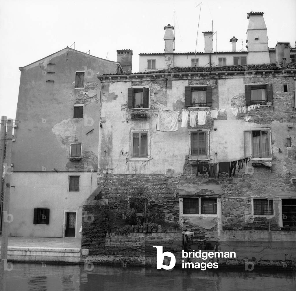 Building overlooking a Venetian canal (b/w photo)