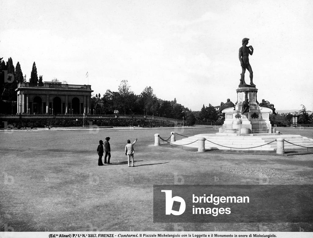View with people of the Michelangelo Piazza with the monument in honor of Michelangelo and the small gallery in the background, Florence.
